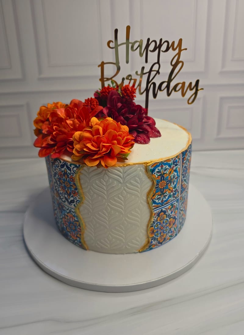 Neon birthday cake with colorful balloons